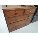 A Victorian oak chest of two over three drawers