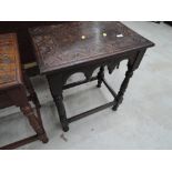 An early 20th Century carved oak occasional hall table