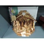 A wooden hand carved Christmas nativity set