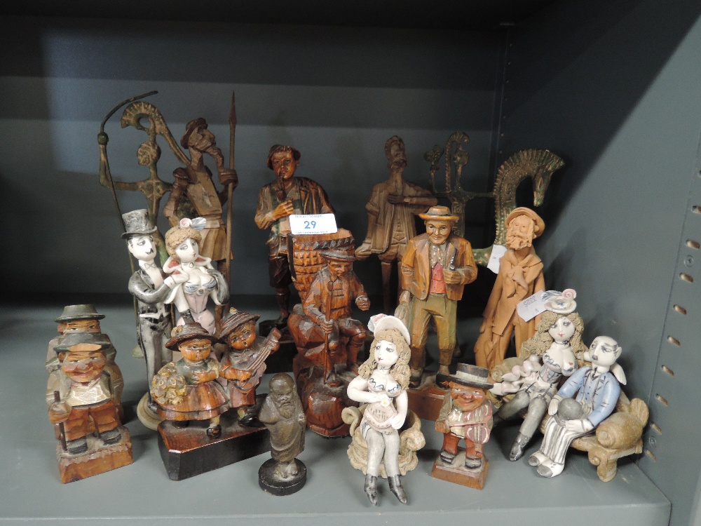 A selection of figures and figurines including wooden ceramic and cast