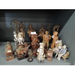 A selection of figures and figurines including wooden ceramic and cast