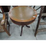 A reproduction Regency style drum type occasional table