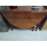 An early to mid 20th Century mahogany gateleg dining table
