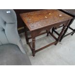 An early 20th Century carved oak occasional hall table