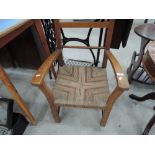 A vintage low strung seat armchair