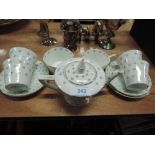 A vintage miniature tea and coffee set, 4 settings, stamped H M Wildman & Sons (early Shelley)