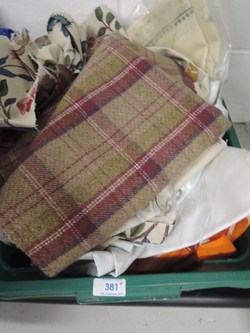 A mixed box of fabric, various sizes and styles including Sanderson and similar quality fabrics.