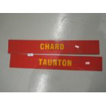 Two red and yellow plastic transport related signs for Chard and Taunton