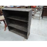 A rustic book or tool shelf