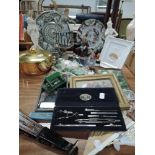 A selection of curios and trinkets including figures and geometry set
