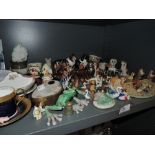 A selection of figures and figurines including Wade style