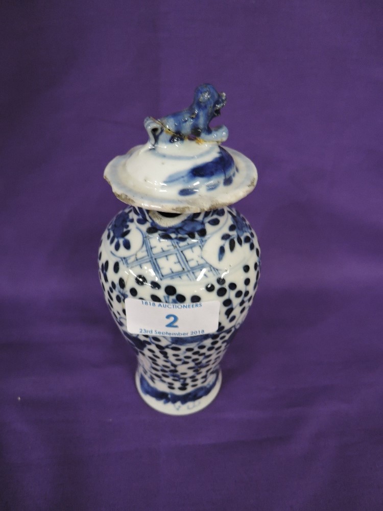 A hard paste Chinese export lidded urn with hand decorated imagery AF