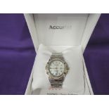 A lady's quartz wrist watch by Accurist having a baton and Arabic numeral dial with date aperture on