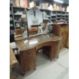 A mid 20th Century walnut dressing table