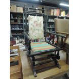 A 19th century dark stained American style rocking armchair