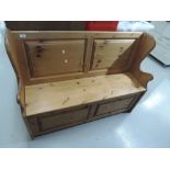 A modern pine box settle