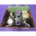 A small jewellery box containing a selection of costume jewellery including brooches, Pulsar