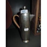 A coffee pot by Nick Monroe in pewter