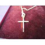 A 9ct gold cross pendant and chain (AF)