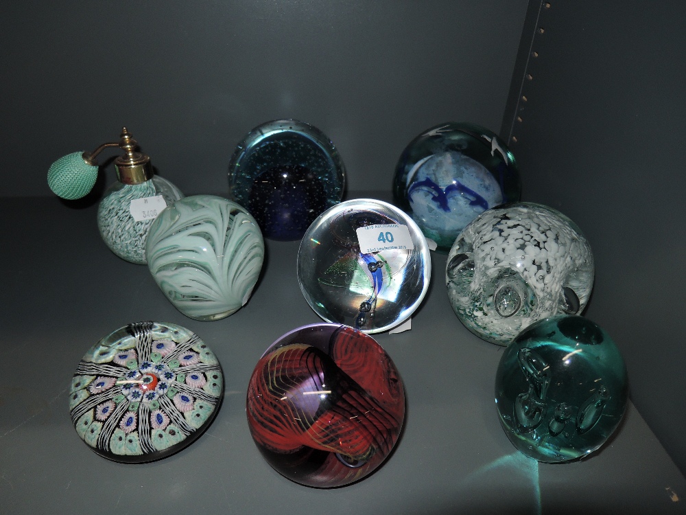 A selection of glass paper weights including Sorcerer limited run