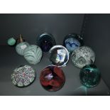 A selection of glass paper weights including Sorcerer limited run