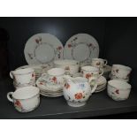 A part tea or coffee service by Doulton Burslem with raised and printed design