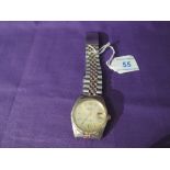 A gents fashion wrist watch bearing the name Rolex having a baton numeral dial and date aperture
