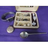 A small jewellery case containing costume jewellery including wrist watch, rings, locket etc