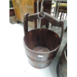 A traditional wooden milk or water pail, possibly Chinese