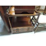 A modern mahogany occasional table with undrawers base