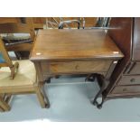 A vintage mahogany cased integral sewing machine table, by Singer 319K