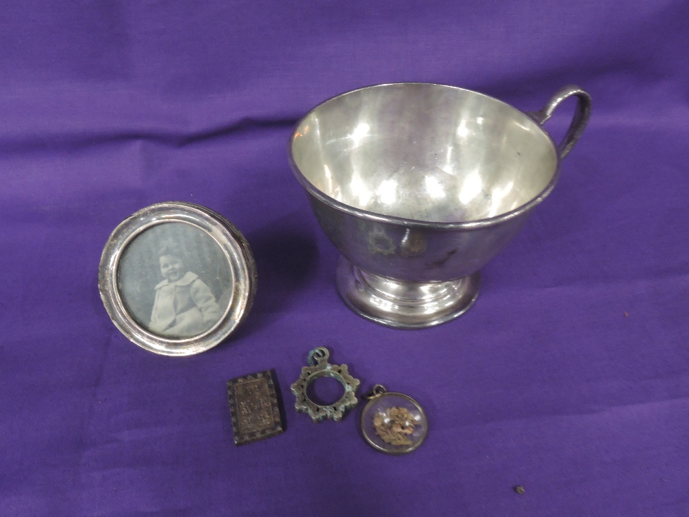 A silver christening cup of plain form having inscription to front and pedestal foot, Chester