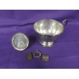 A silver christening cup of plain form having inscription to front and pedestal foot, Chester