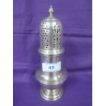 A silver sugar castor of waisted baluster form having pierced lid and engraving to body,
