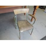 A vintage metal and ply childs chair