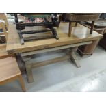 An early 20th Century drawer leaf dining table, stripped oak