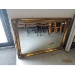 A modern gilt framed overmantle mirror