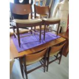 A mid century teak extending table and 4 chairs, possibly Scandinavian