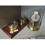 A clock and barometer set with anniversary clock