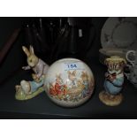 A selection of Beatrix potter figures and similar money bank