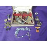 A travel jewellery case containing a selection of costume jewellery including Indian style earrings,