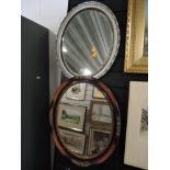 Two oval wall mirrors