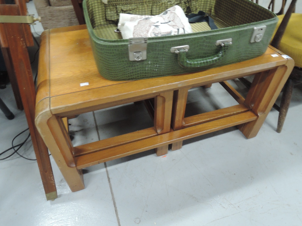 A vintage coffee table nest of stylised design