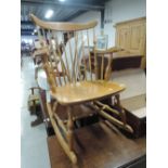 A traditional spindle back rocking chair