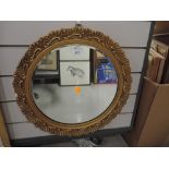 A gilt and plaster frame mirror