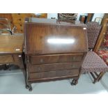 An early to mid 20th Century mahogany bureau on cabriole legs