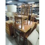 A modern tile top and rubber wood kitchen table and 4 chairs