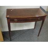 An Edwardian mahogany side table having line inlay decoration, with frieze drawer and tapered legs