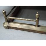 A 20th century brass period style adjustable fire fender