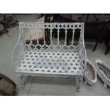 A 19th century style white painted cast garden bench/seat of Regency design